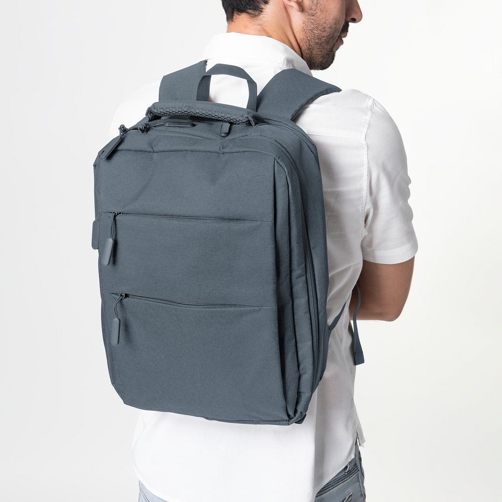 Man with dark blue laptop backpack rear view studio shoot