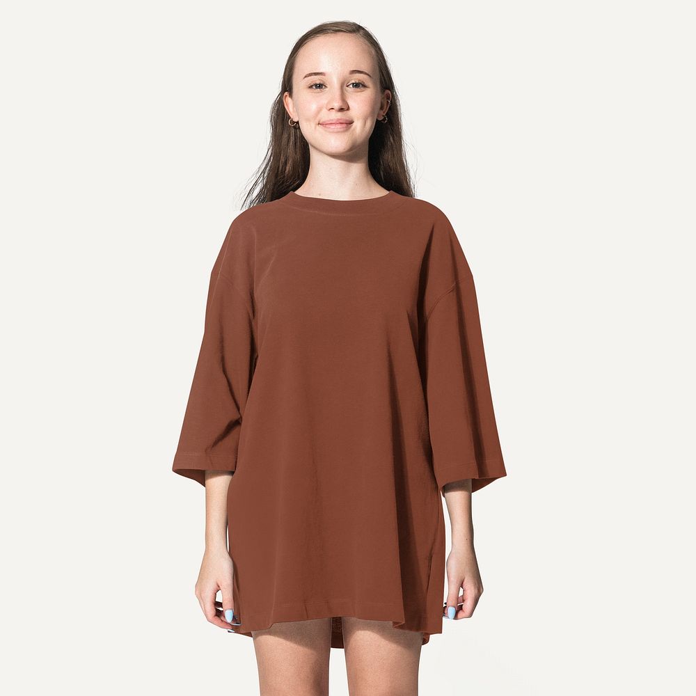 Young woman in brown oversized t shirt, fashion shoot with design space