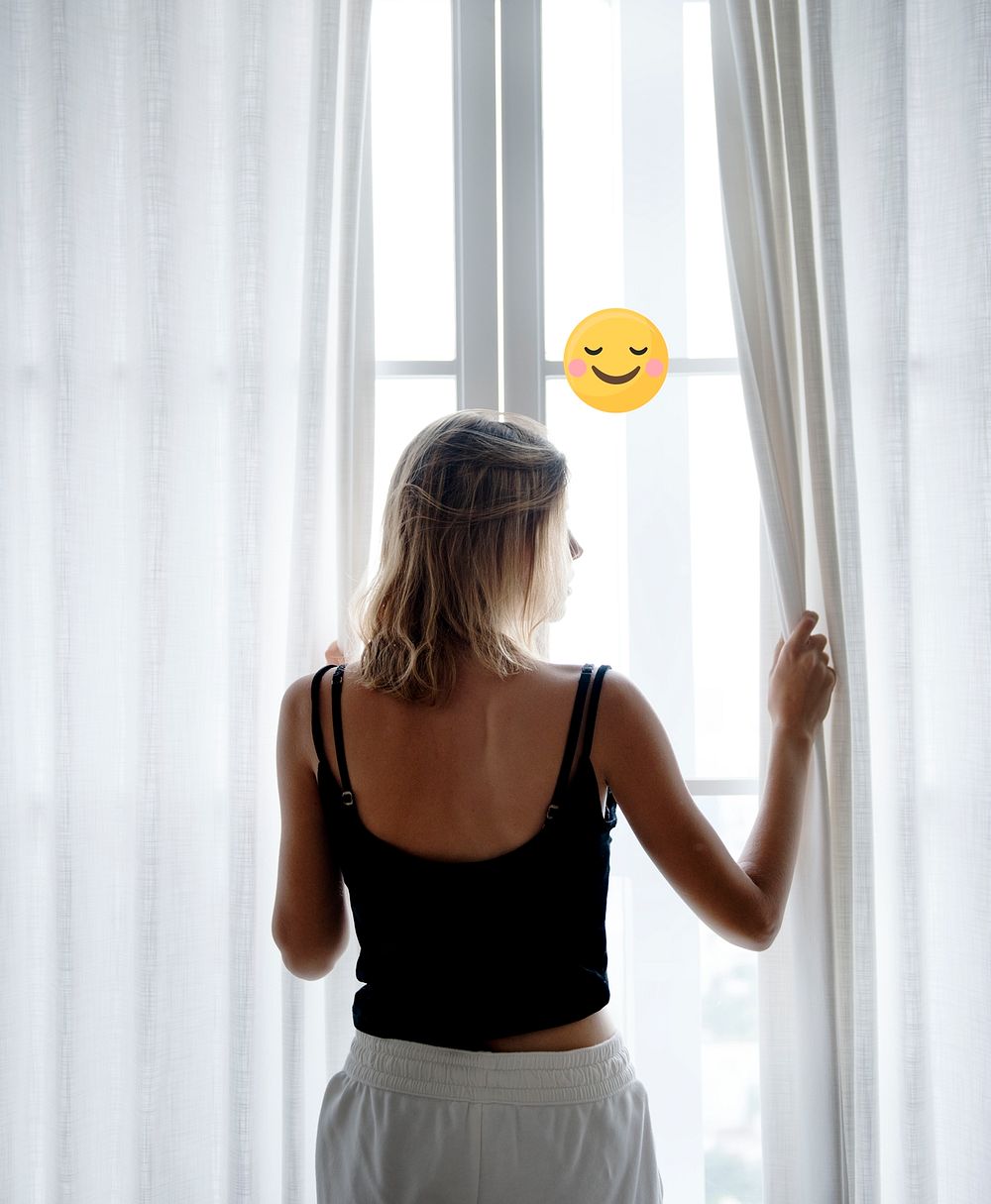 Woman staring out her window