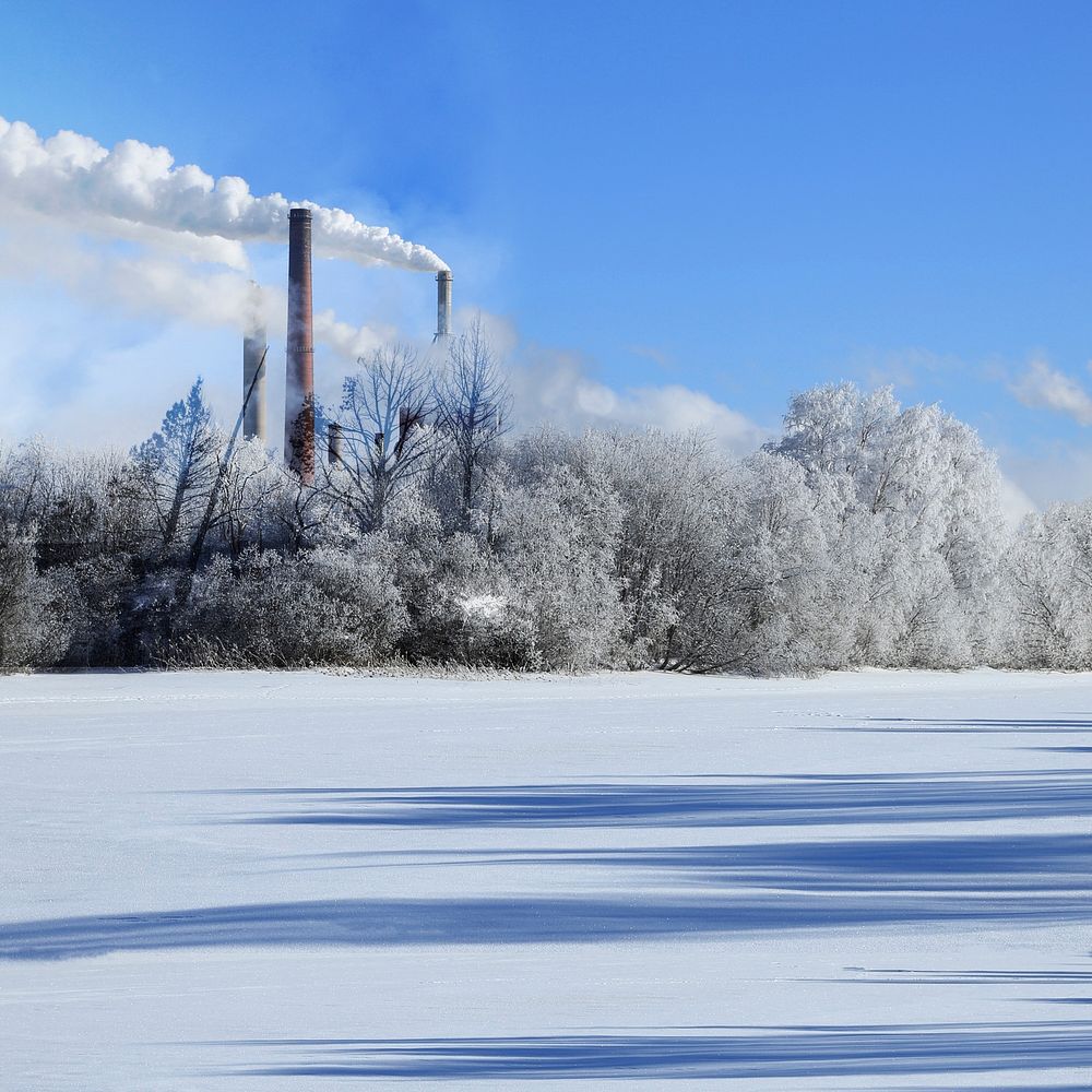 Winter landscape background, factory polluting air