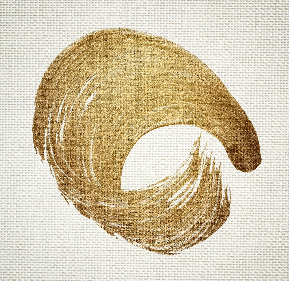 Gold oil paint brush stroke texture on a beige fabric textured background