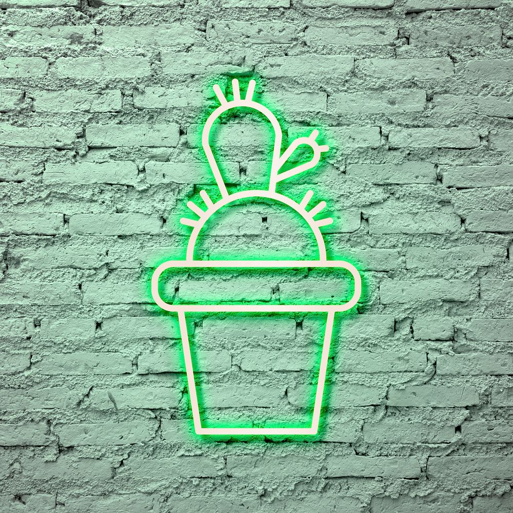 Neon green cactus on a brick wall