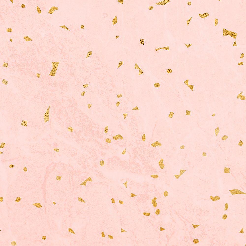 Golden confetti on pink marble textured background