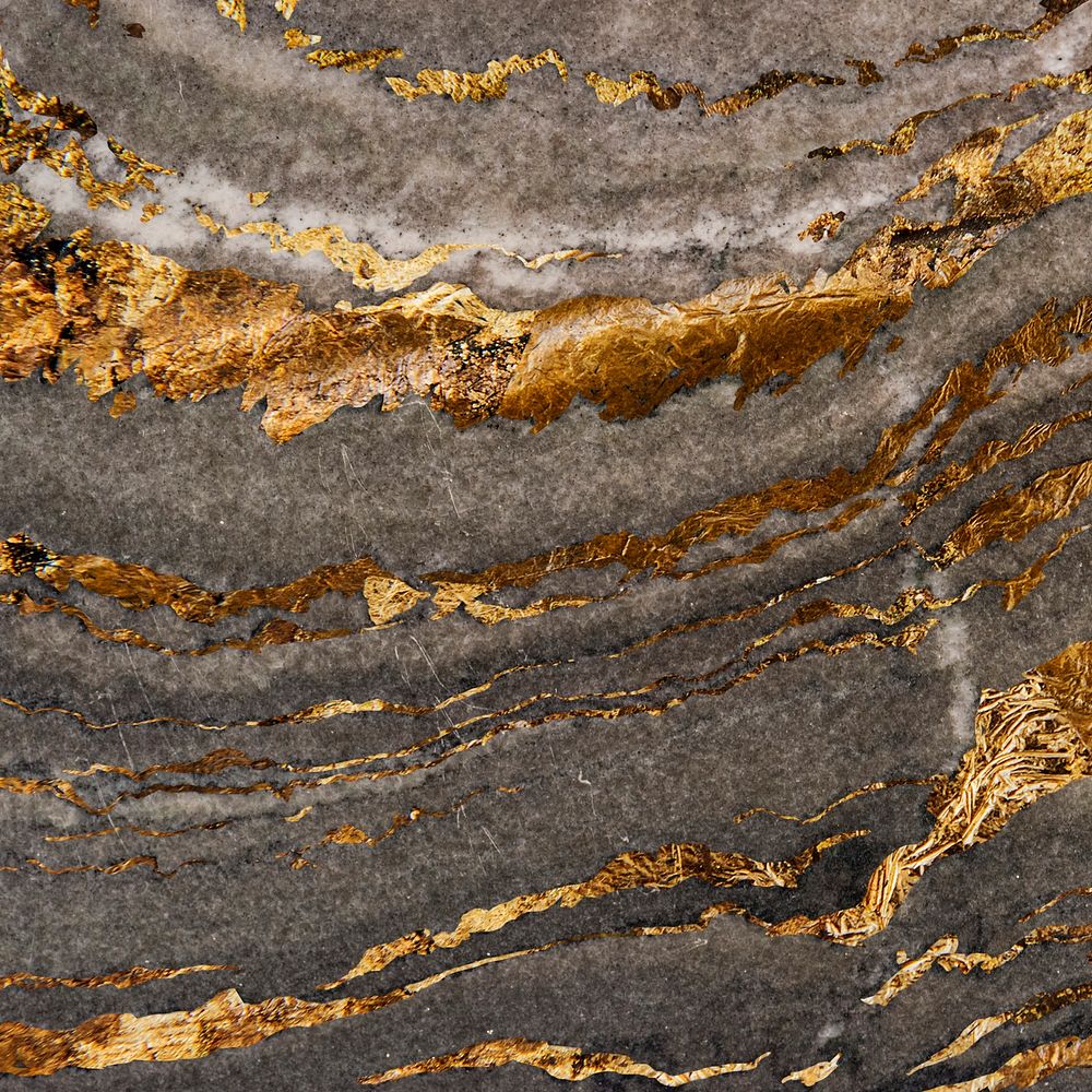 Gray marble rock with gold textured background