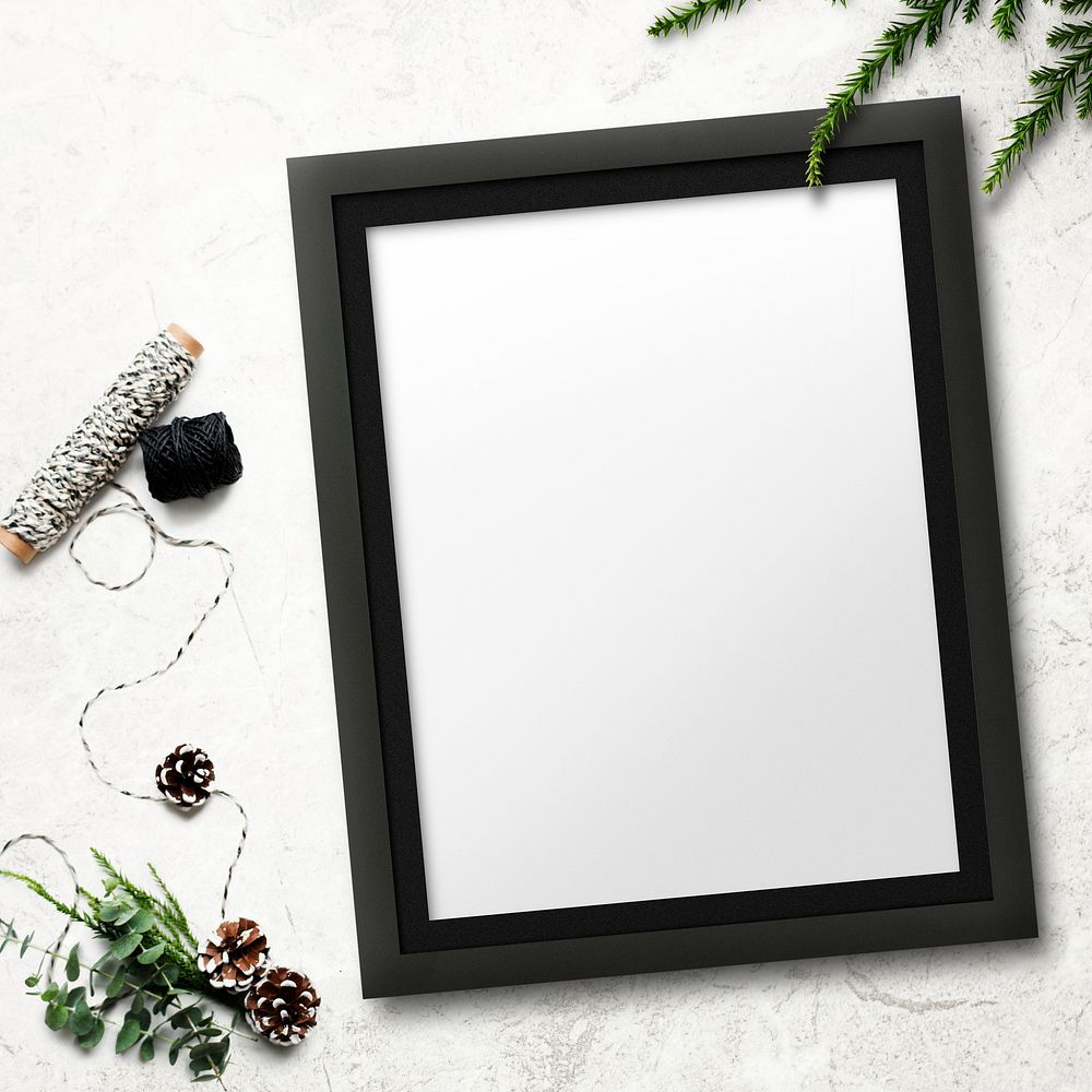 Frame mockup with Christmas decorations on stained background