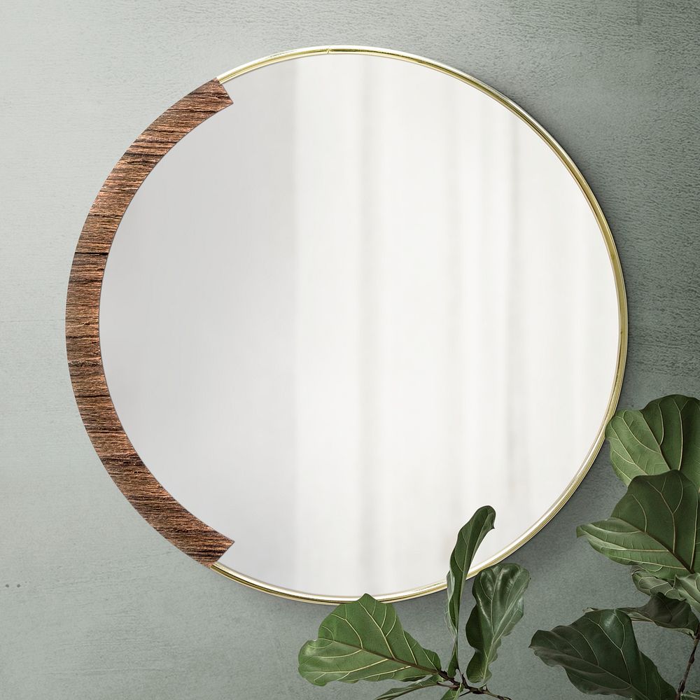 Circular mirror with a wooden backdrop mirroring fiddle-leaf fig on a green wall mockup