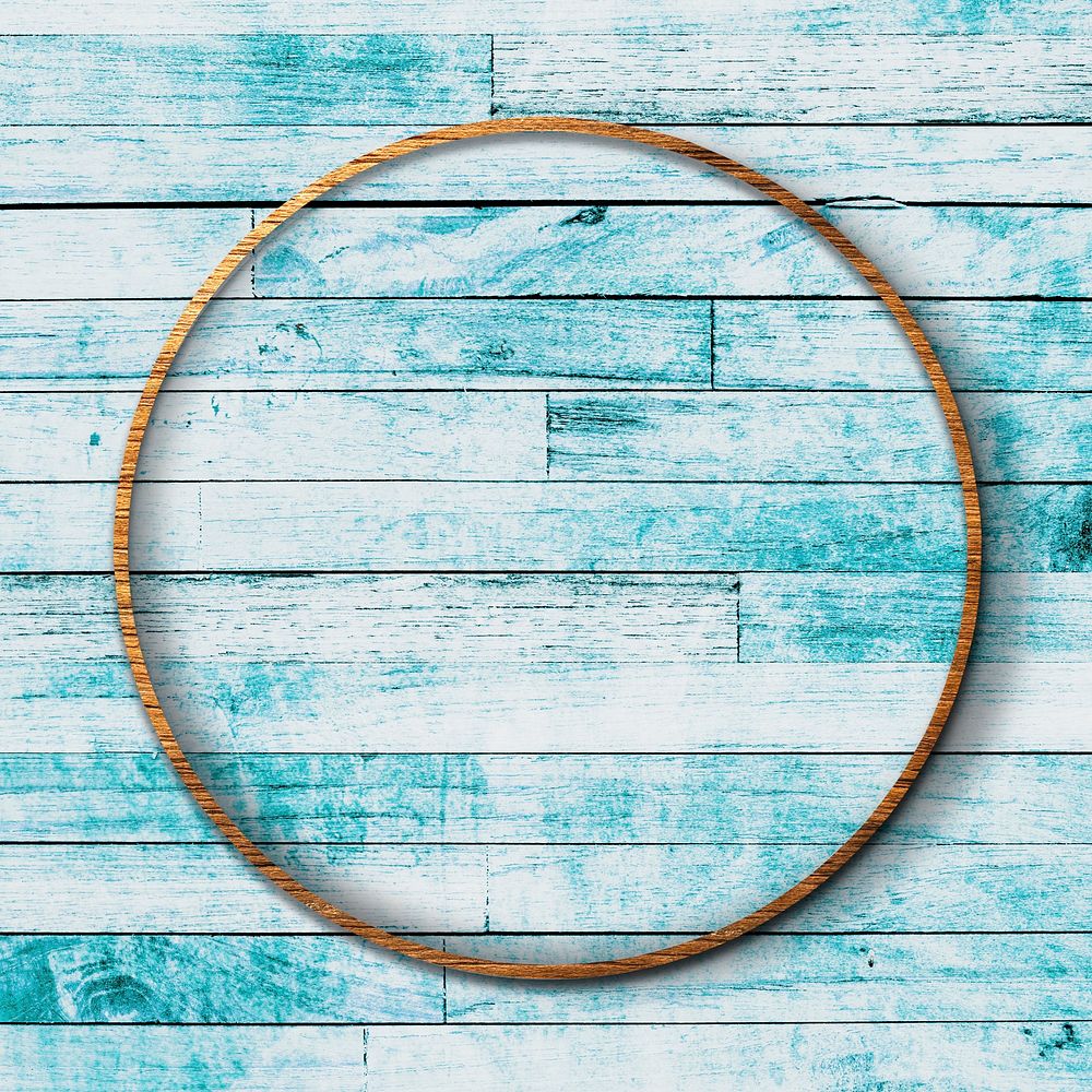 Round frame on light blue wooden texture background