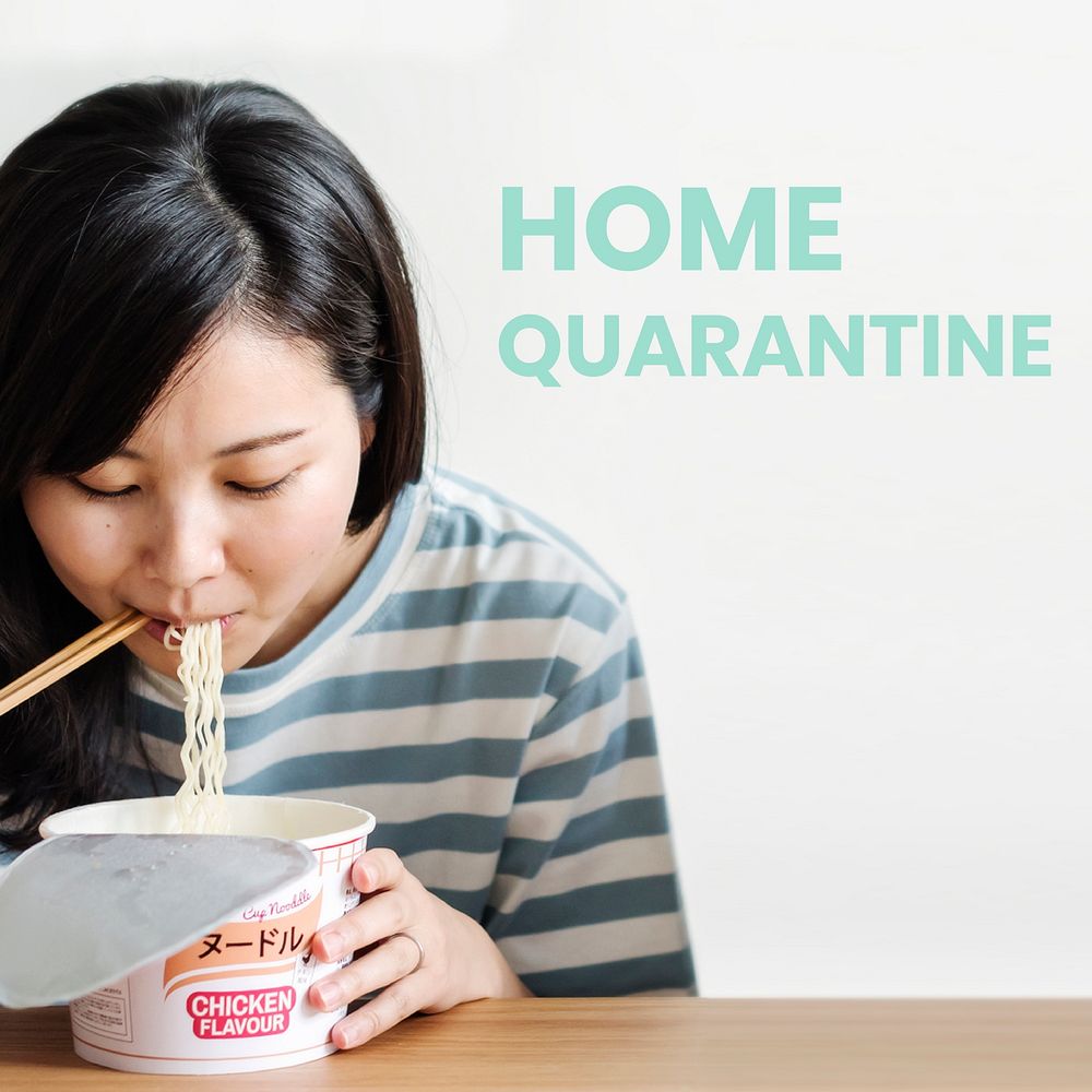 Asian woman eating instant noodles during coronavirus quarantine