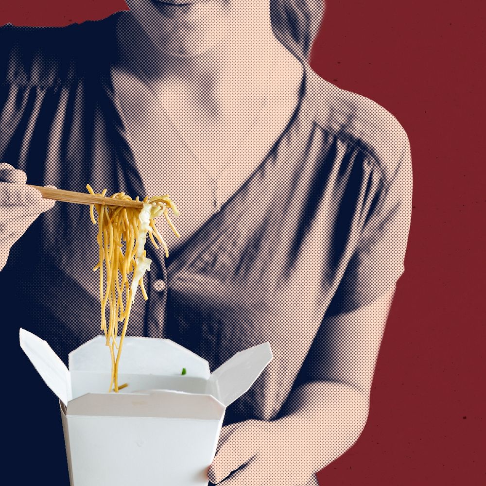 Woman eating a box spaghetti