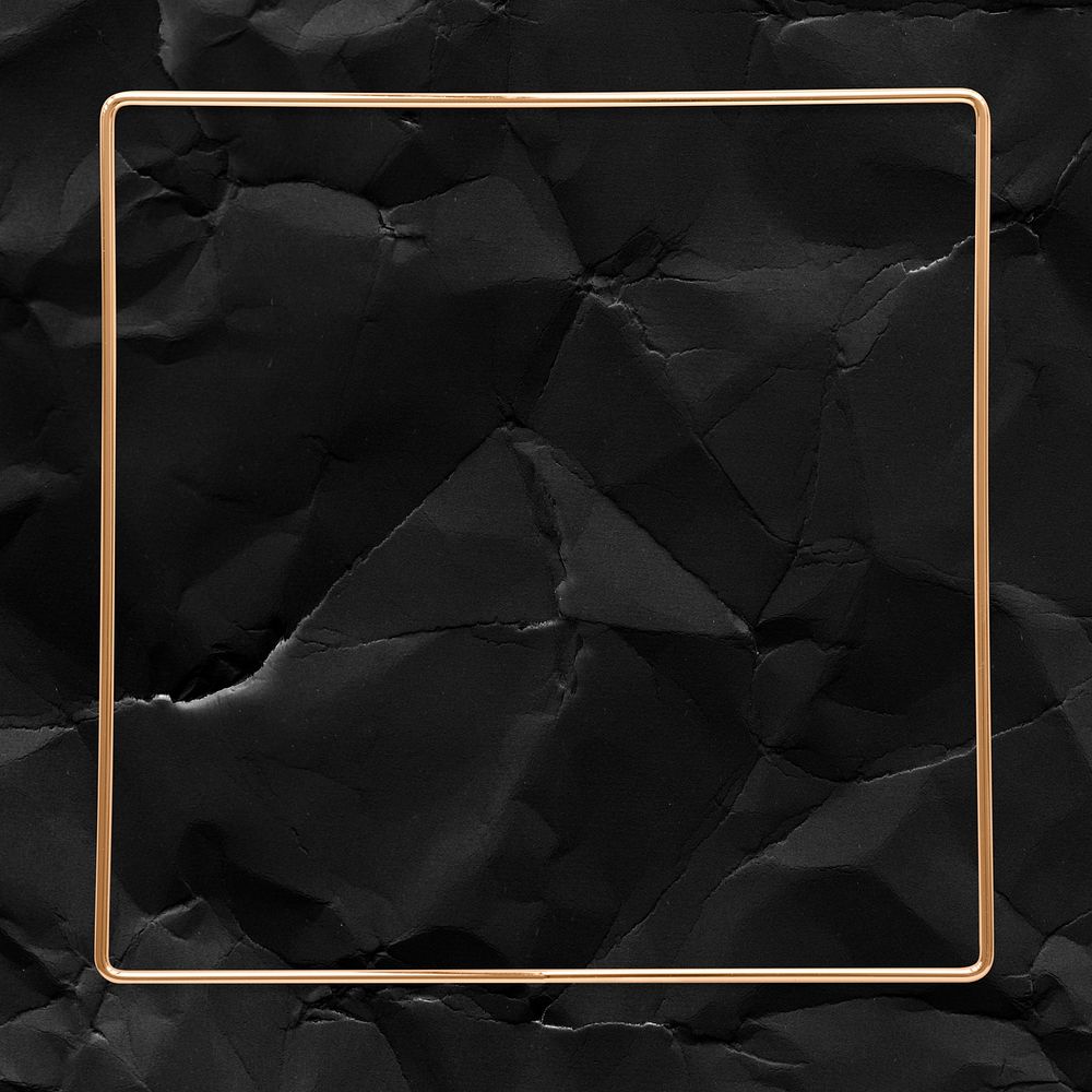 Square gold frame on a crumpled black background