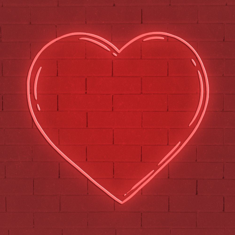 Red neon heart shape on brick wall background