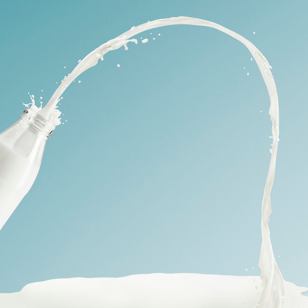 Creamy milk splashing from a glass bottle design resource 