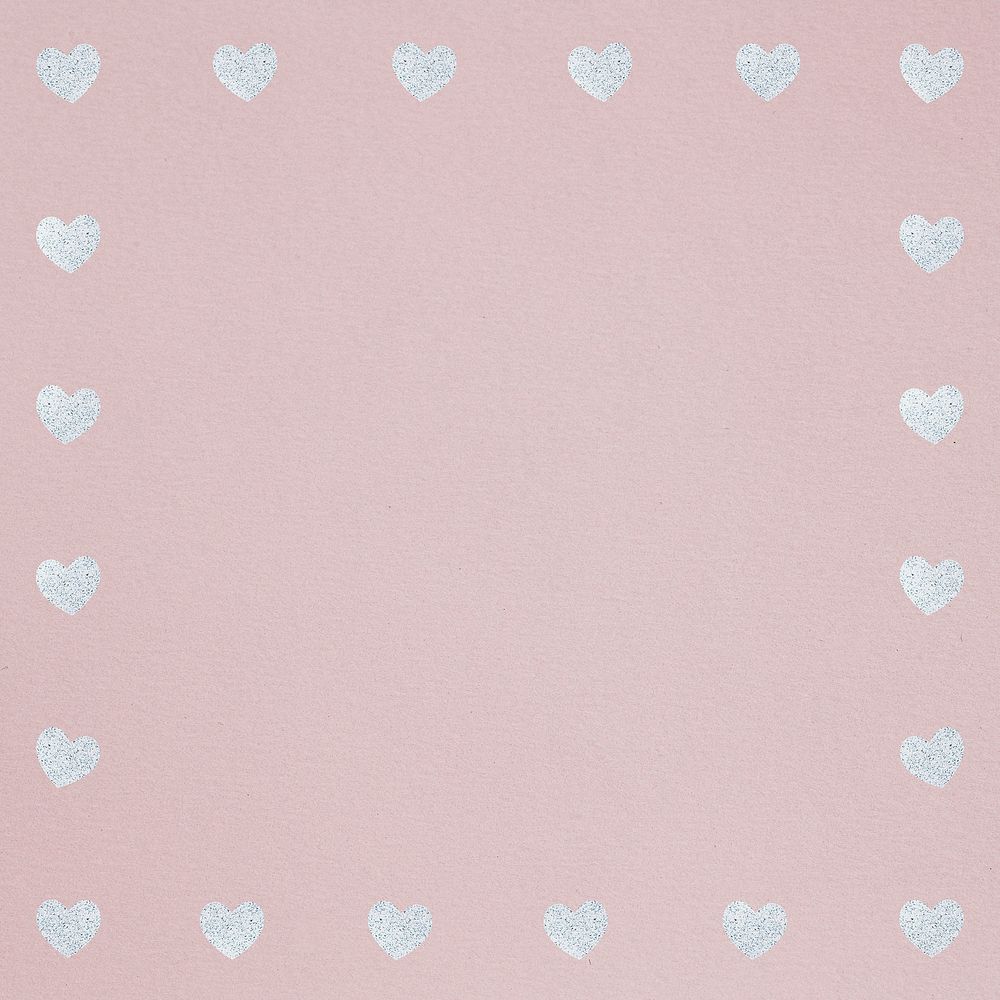 Silver heart patterned frame on a dull pink background