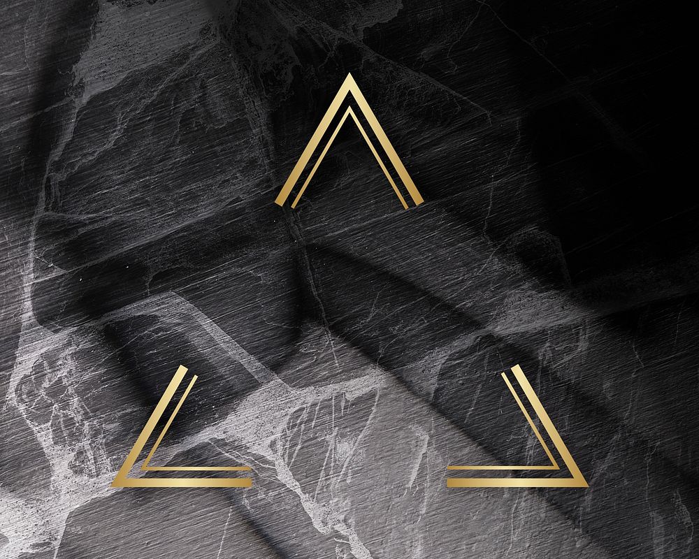 Golden framed triangle on a marble texture