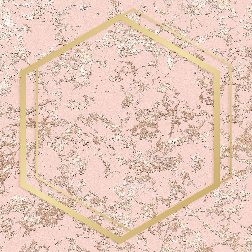 Gold hexagon frame on a rough rose gold background