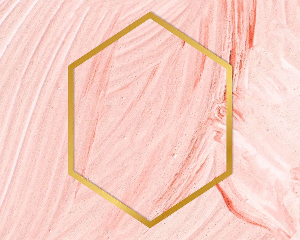 Gold hexagon frame on a pastel pink paintbrush stroke patterned background