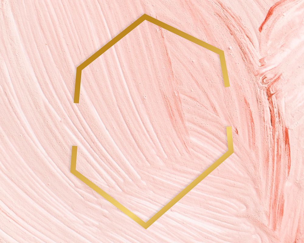 Gold hexagon frame on a pastel pink paintbrush stroke patterned background
