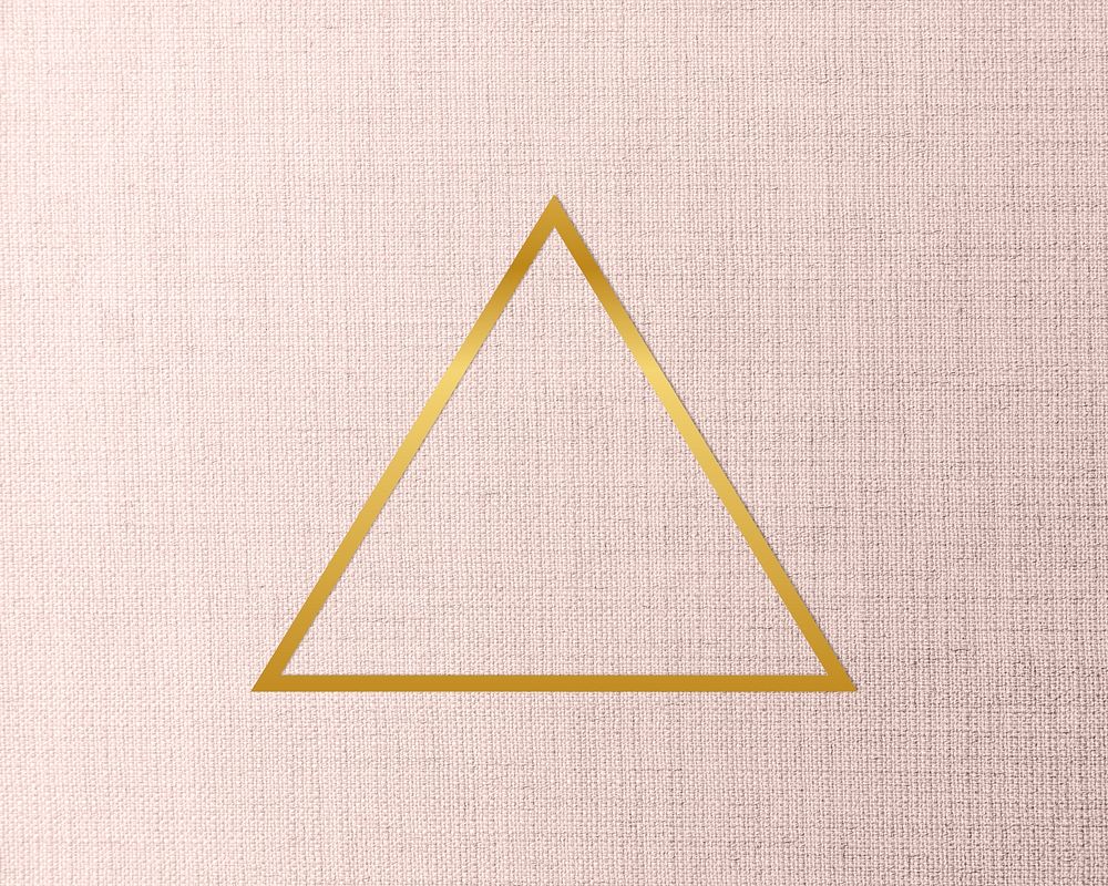Gold triangle frame on a peach fabric background