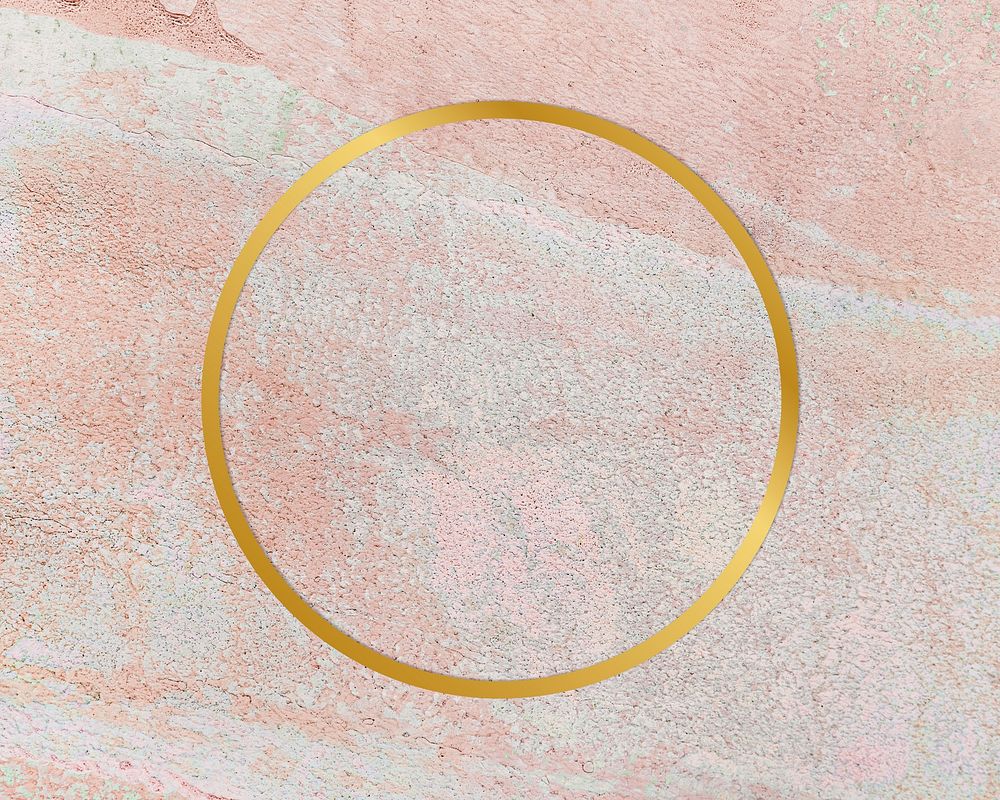 Gold round frame on a rustic pastel pink background