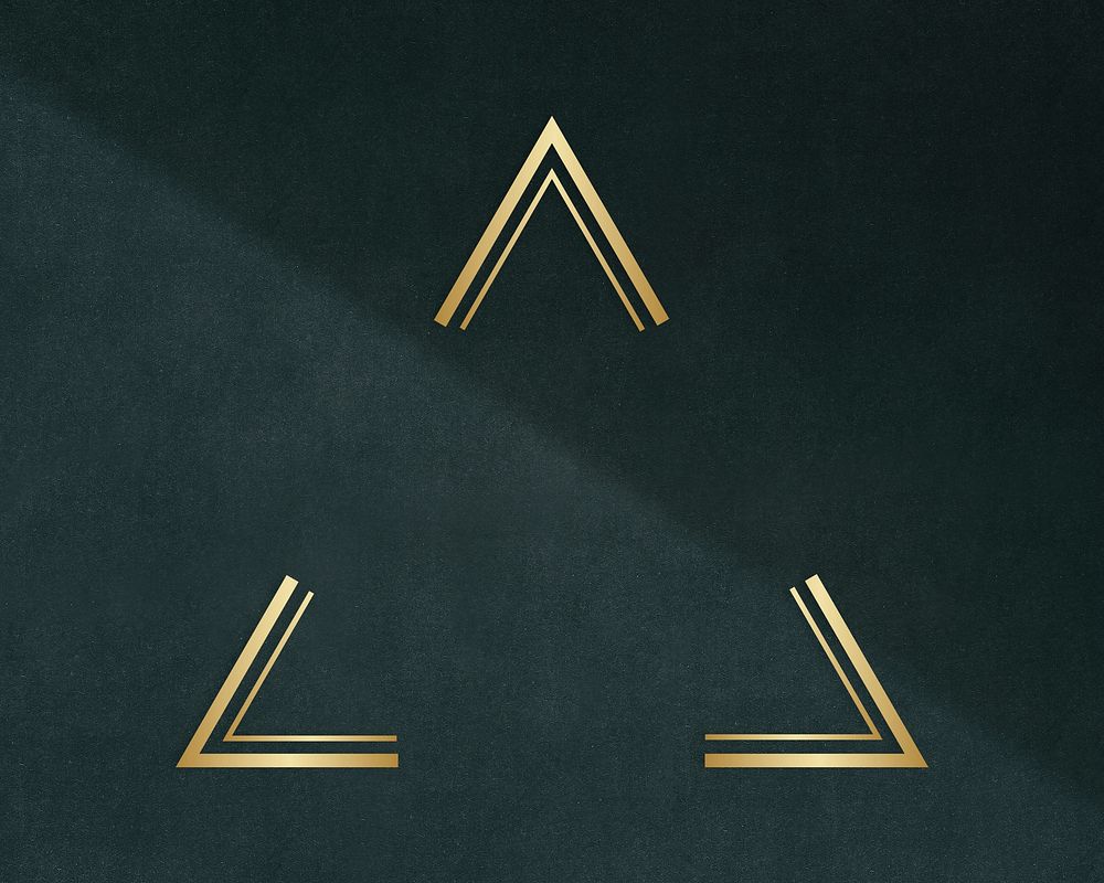 Gold triangle frame on a dark gray concrete textured background