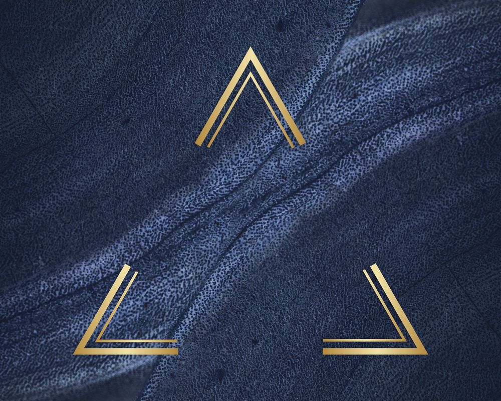 Golden framed triangle on a blue textured stone