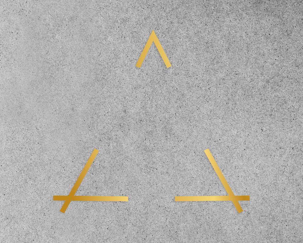 Gold triangle frame on a gray concrete textured background