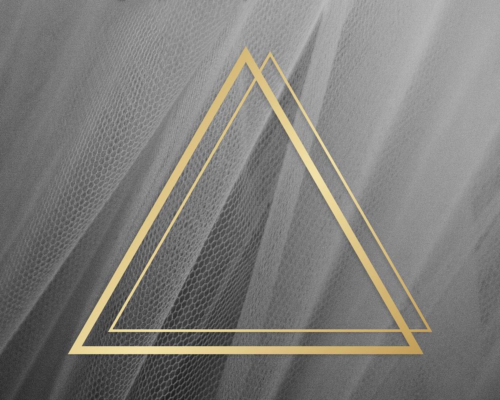 Golden framed triangle on a gray fabric texture