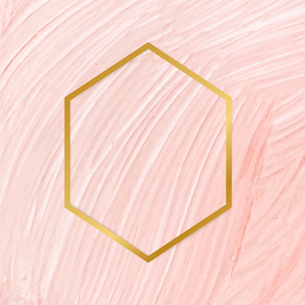 Gold hexagon frame on a pastel pink paintbrush stroke patterned background vector