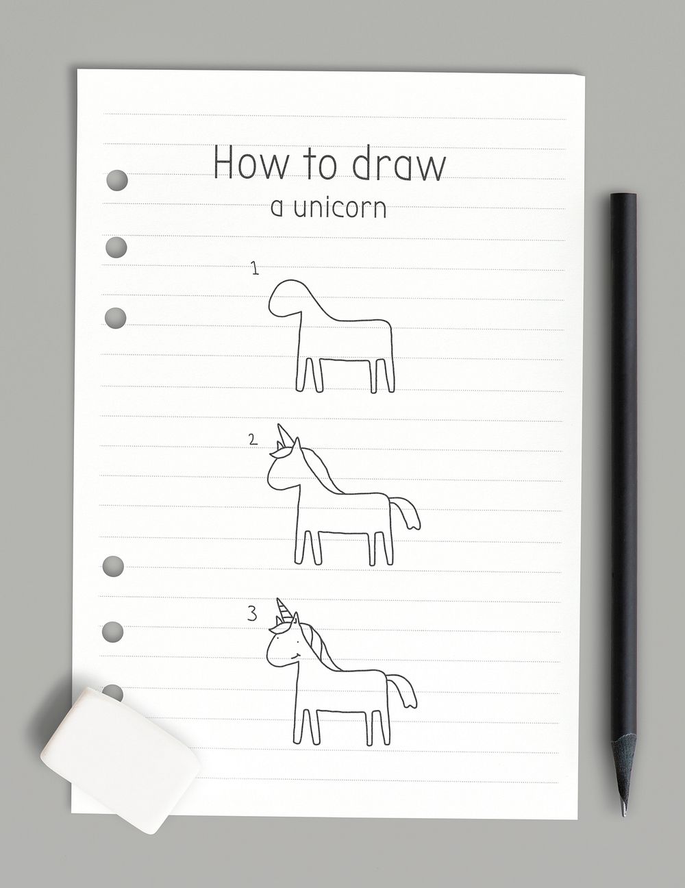 How to draw a unicorn doodle tutorial on a white paper mockup