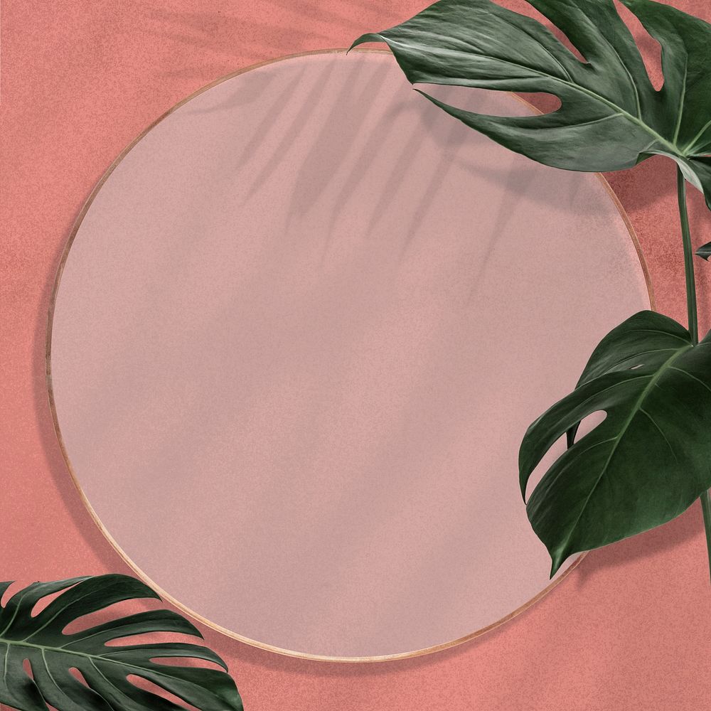 Gold round Monstera leaves frame on pink background