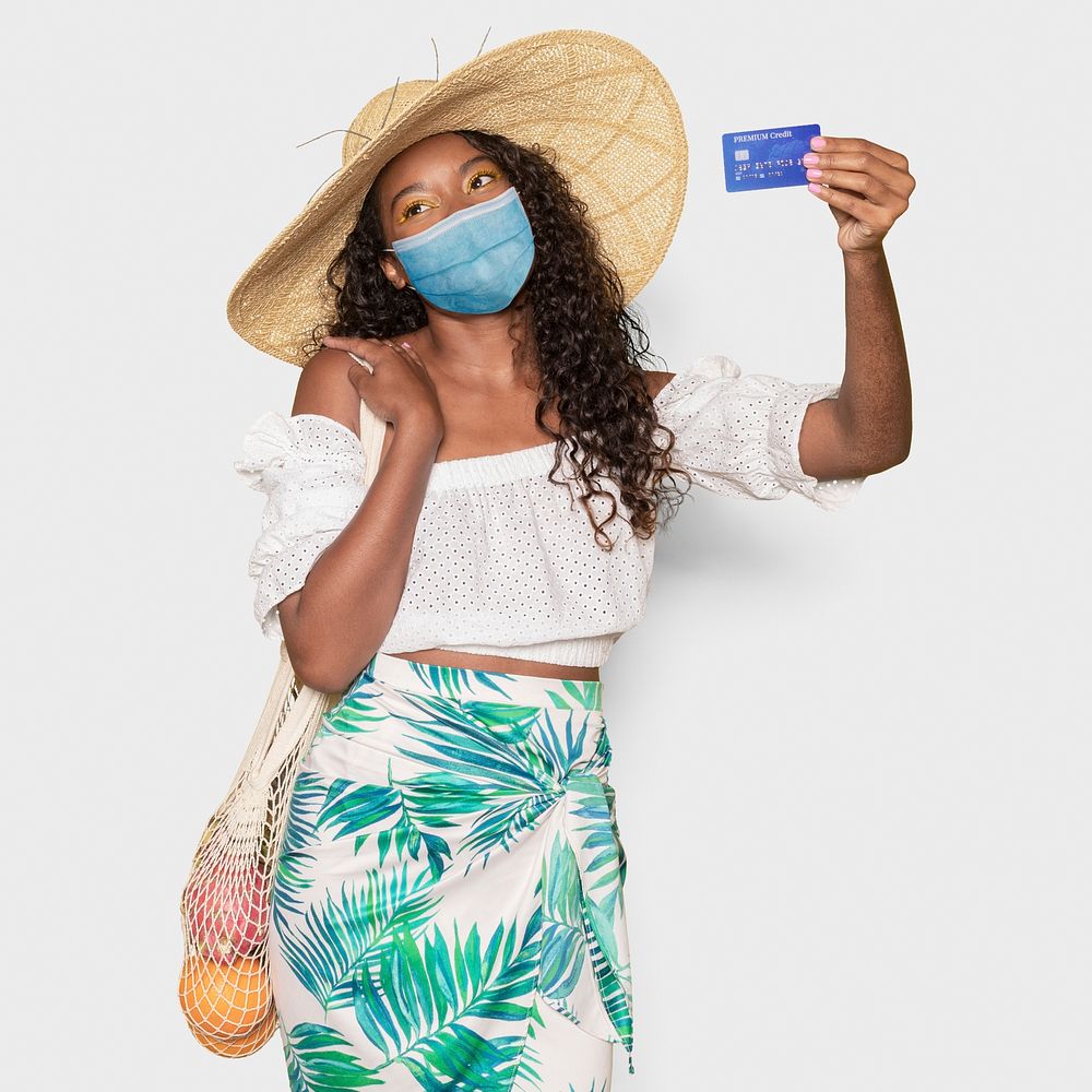 Pandemic vacation in new normal, covid 19 woman holding credit card mockup