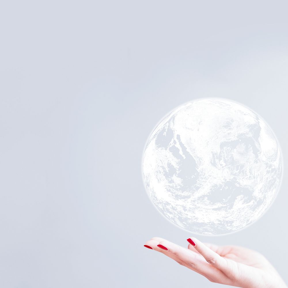 White globe over woman hand gray background