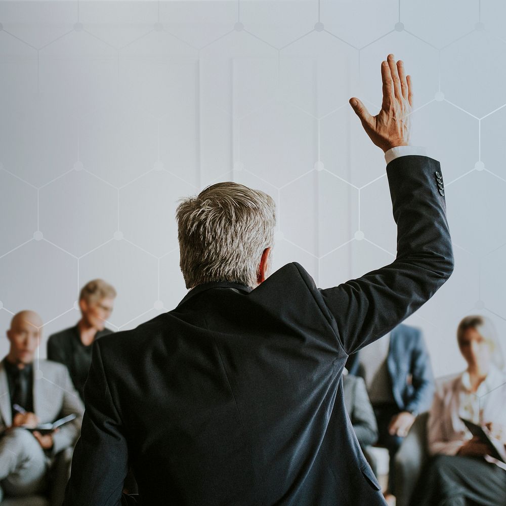 Businessman raising hand in a meeting background