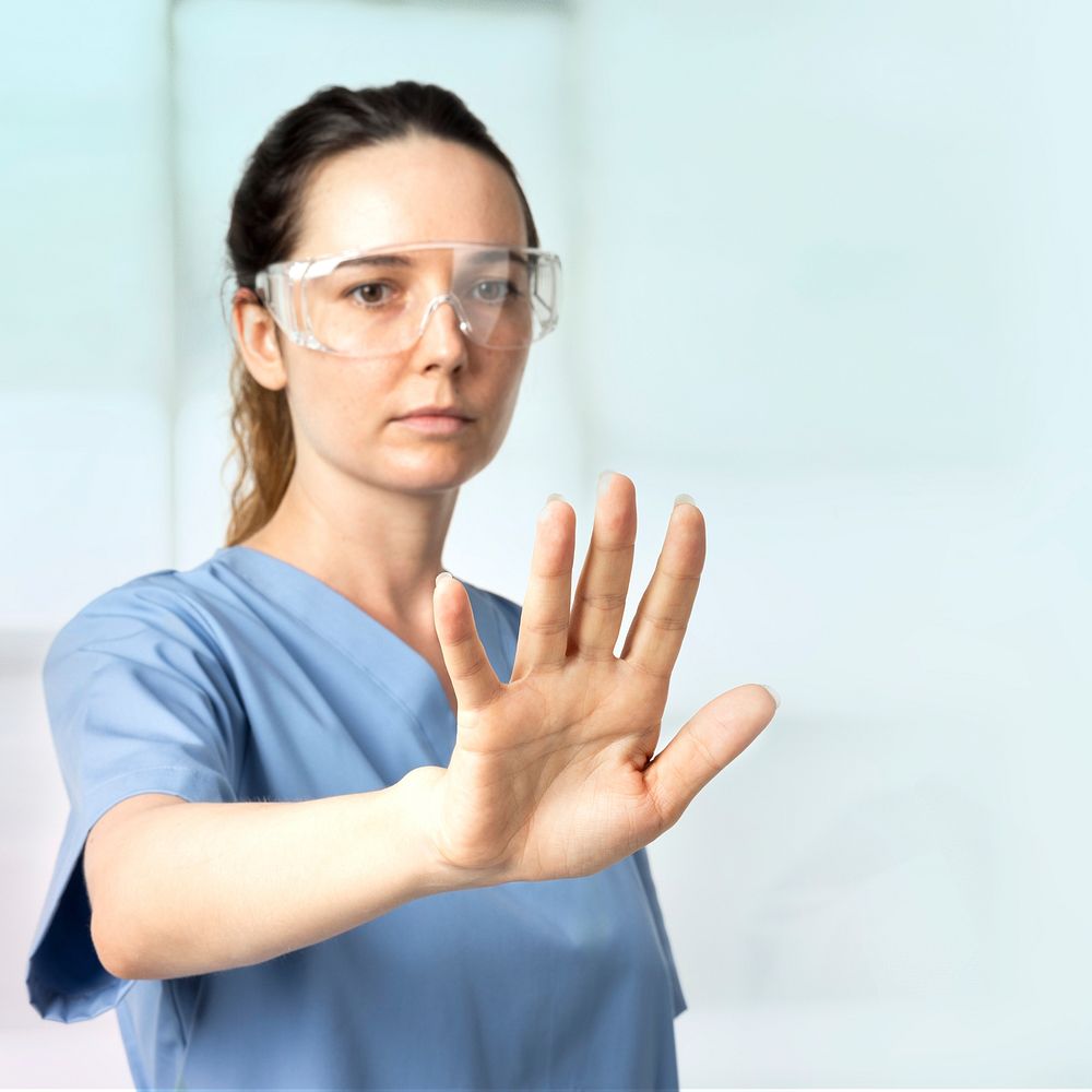 Female doctor  with smart glasses touching virtual screen medical technology