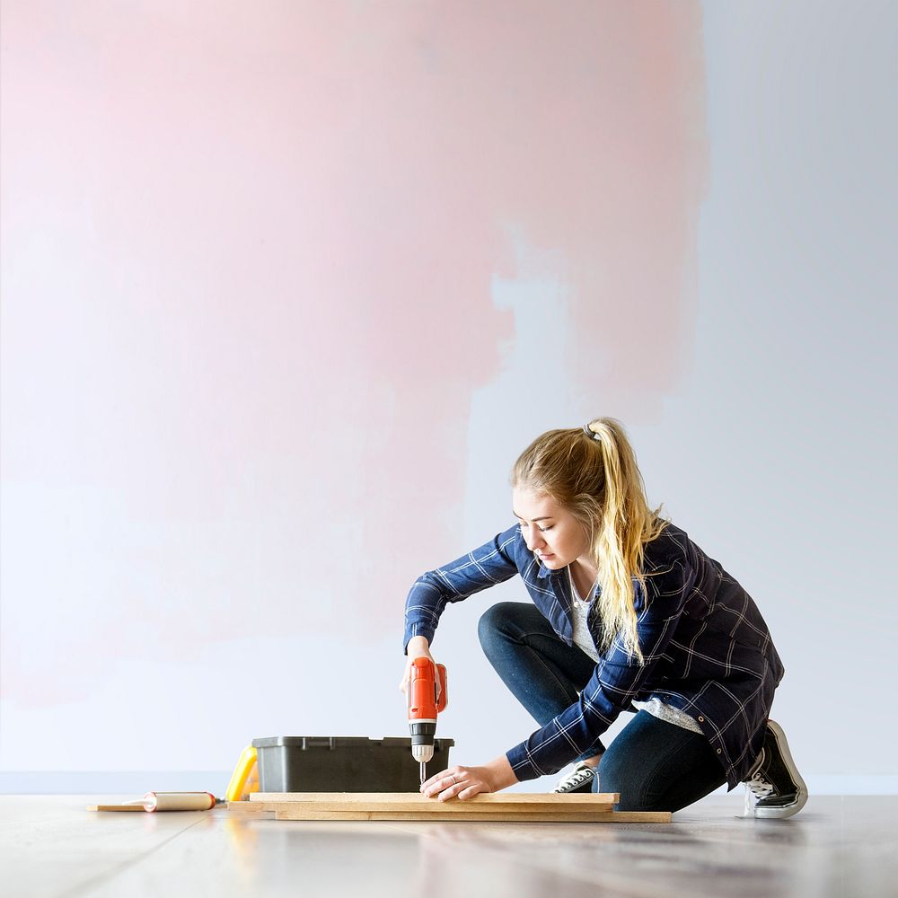 Wall mockup psd with woman renovating the house