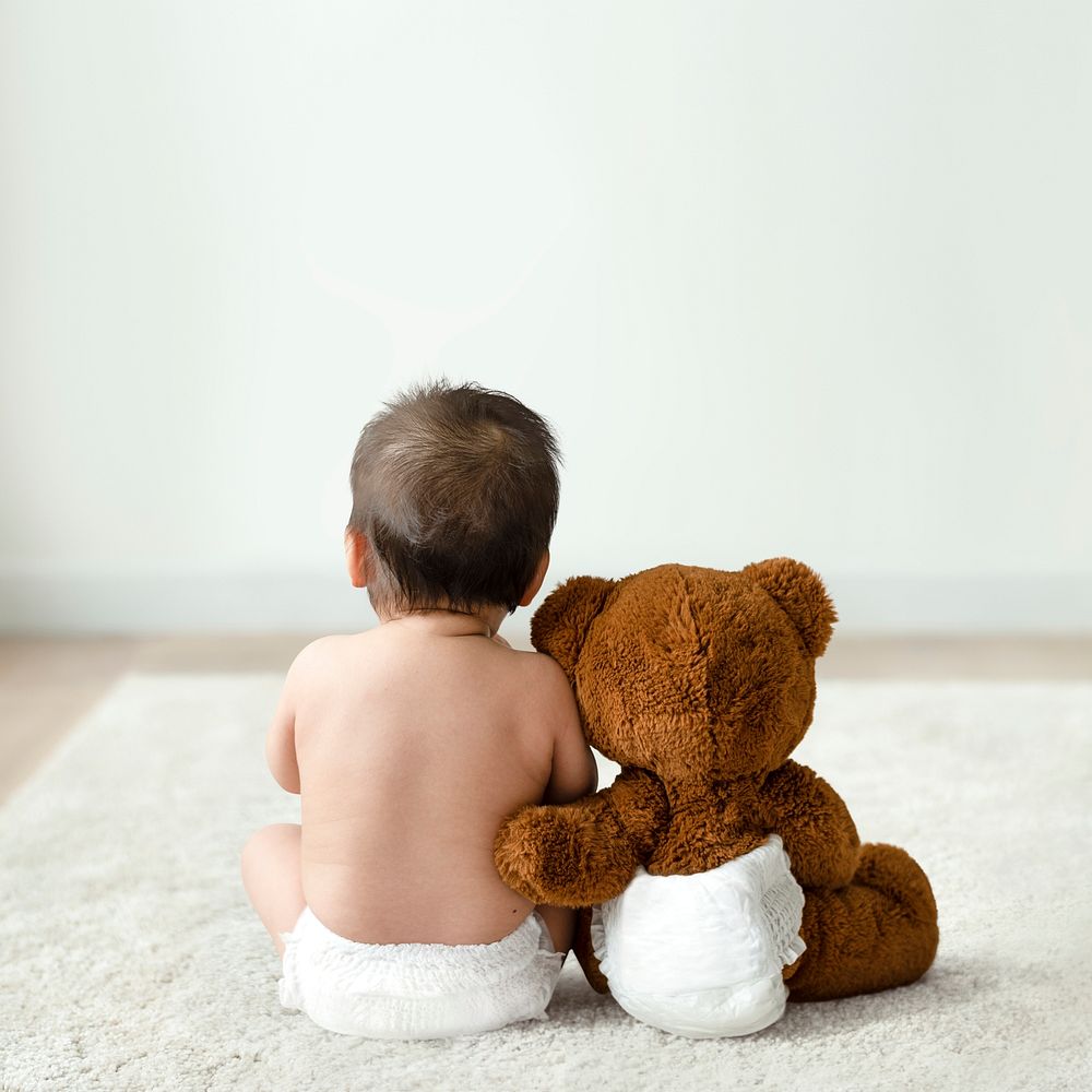 Baby and teddy bear rear view with design space