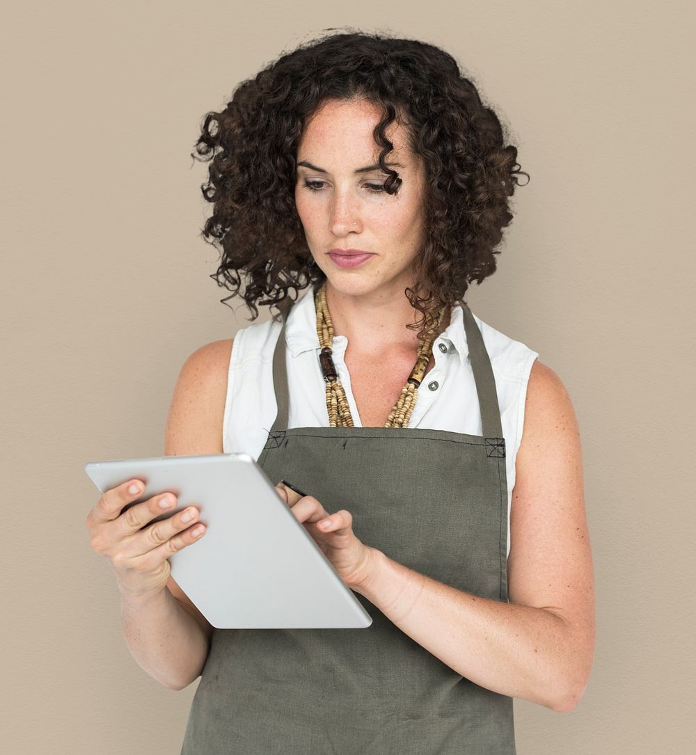 Mature woman taking order on clipboard