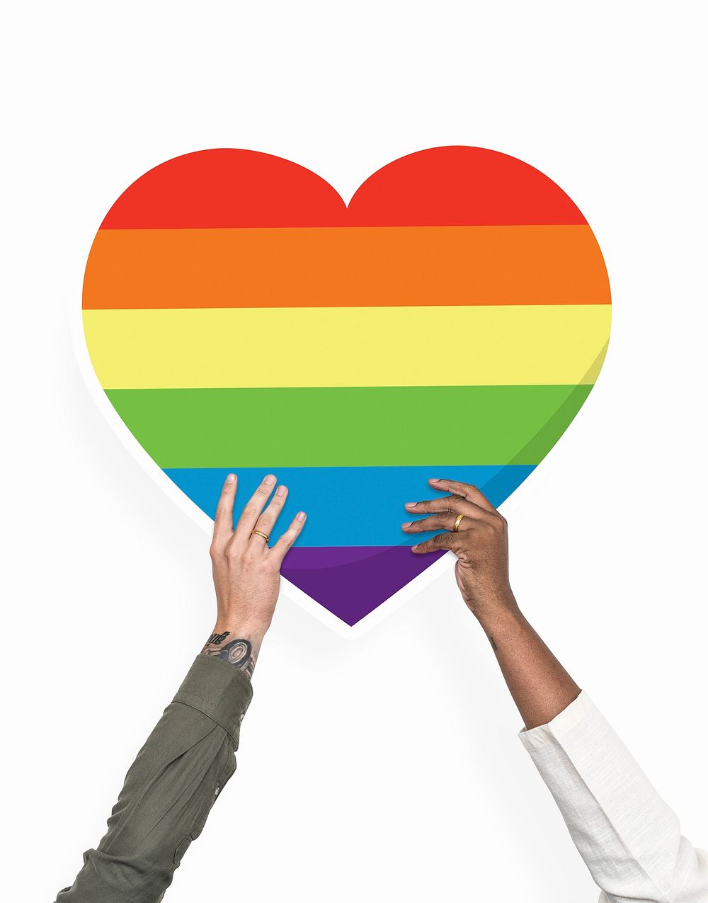 Hands holding a rainbow heart cardboard prop
