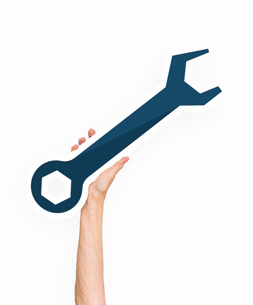 Hand holding a wrench tool