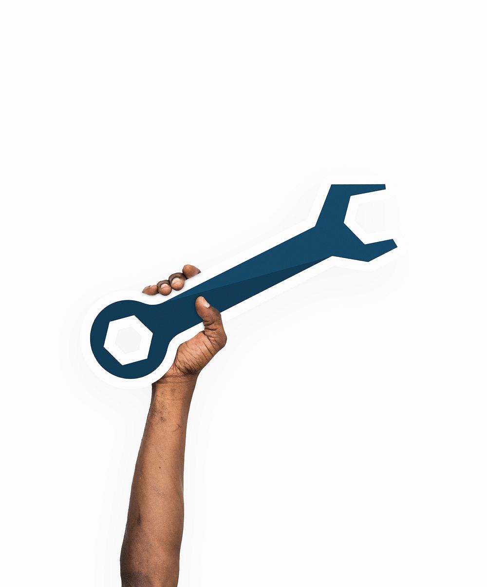 Hand holding a wrench tool