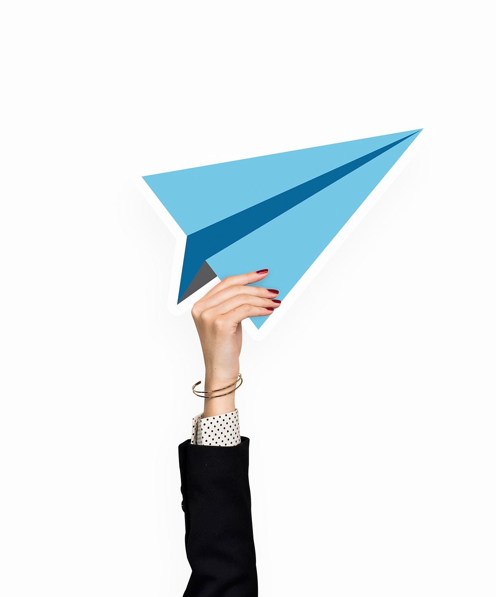 Hand holding a paper plane clipart