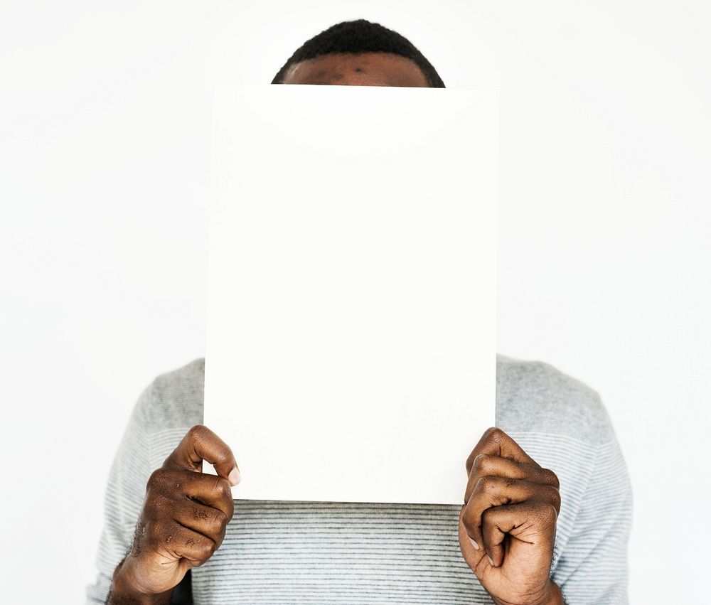 Man holding a blank white board