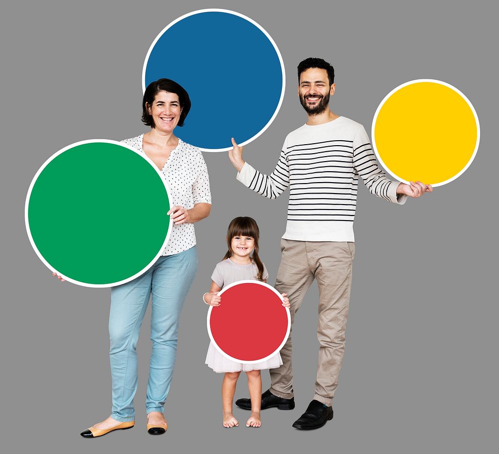 Happy family holding round colorful boards