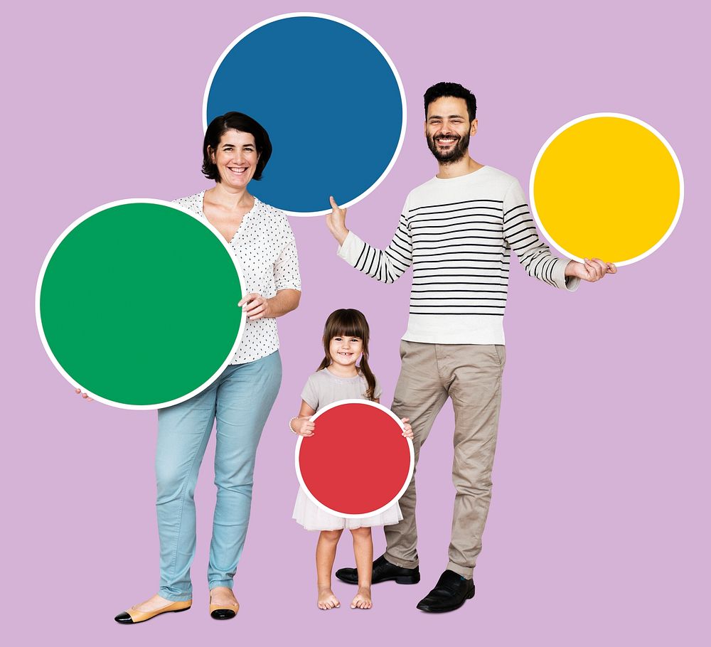 Happy family holding round colorful boards