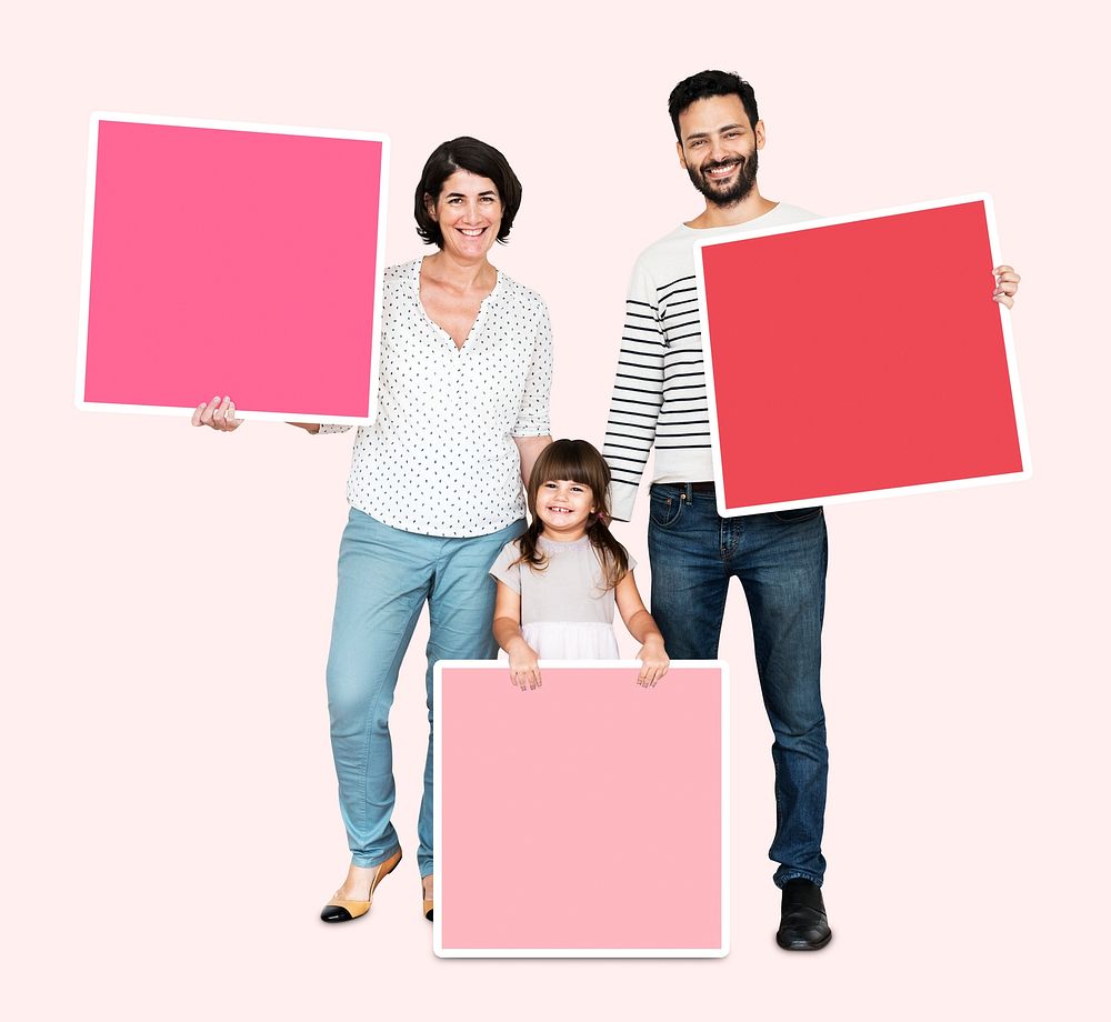 Family holding pink square boards