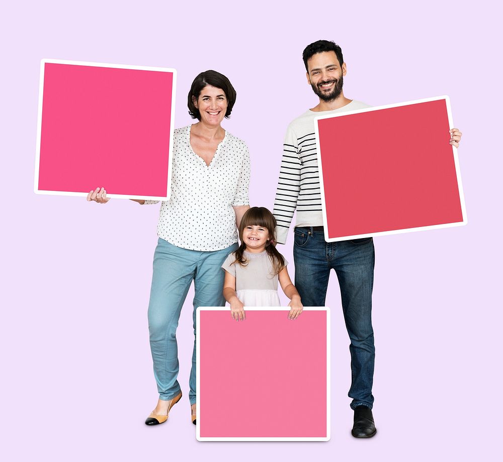Family holding pink square boards