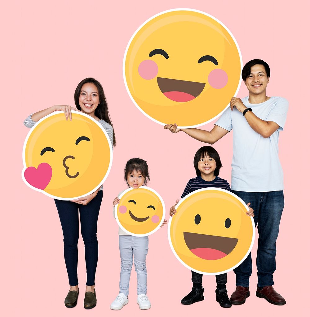 Happy family holding emoji icons