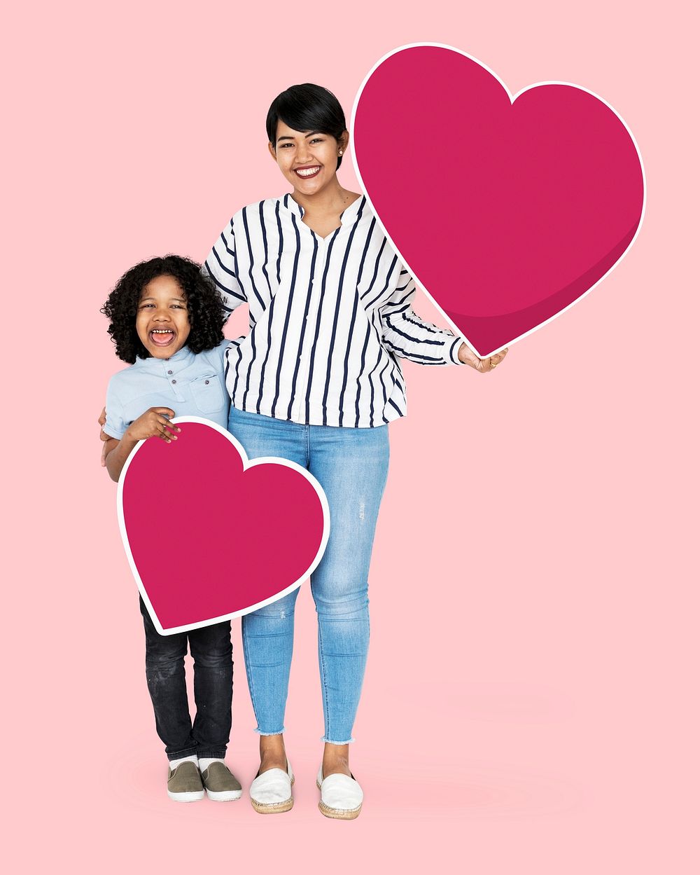Happy mother and son holding heart icons