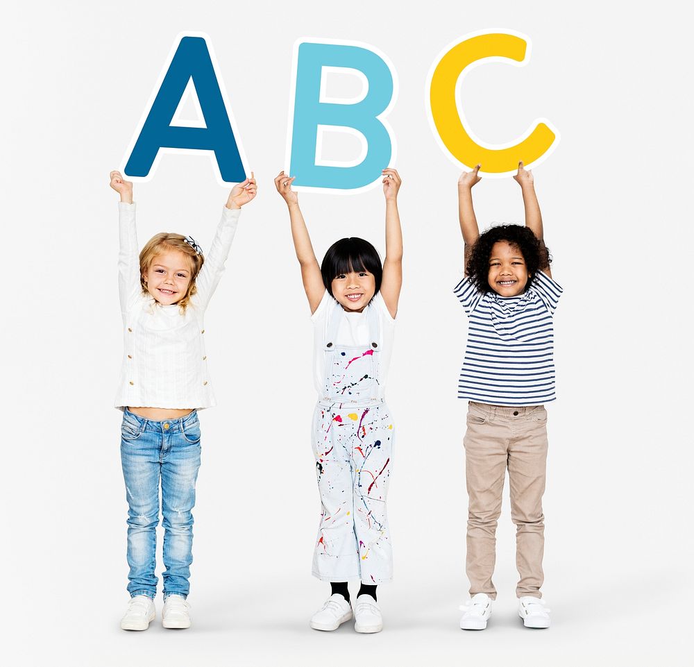 Diverse happy kids holding the ABC