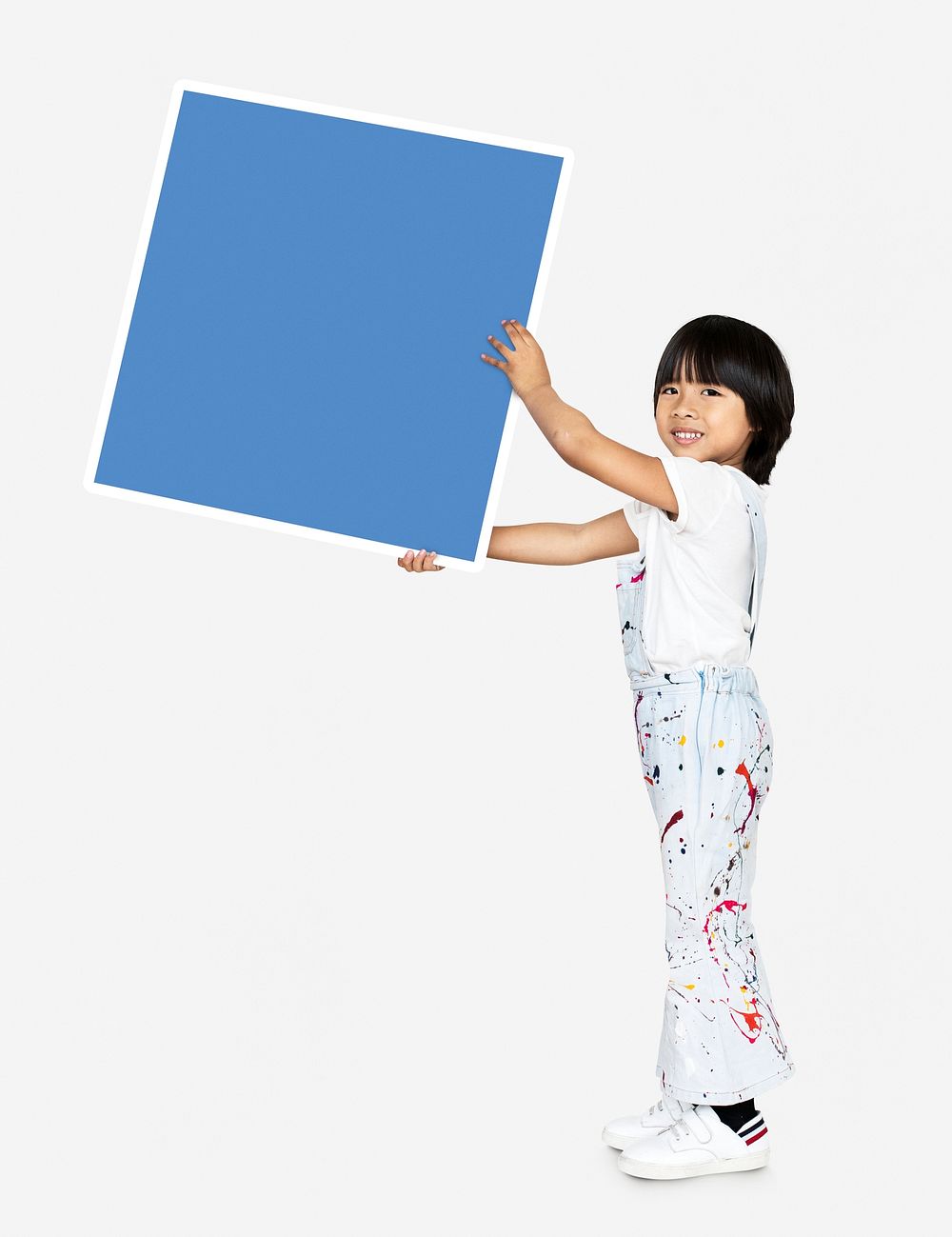 Happy kid holding an empty square board